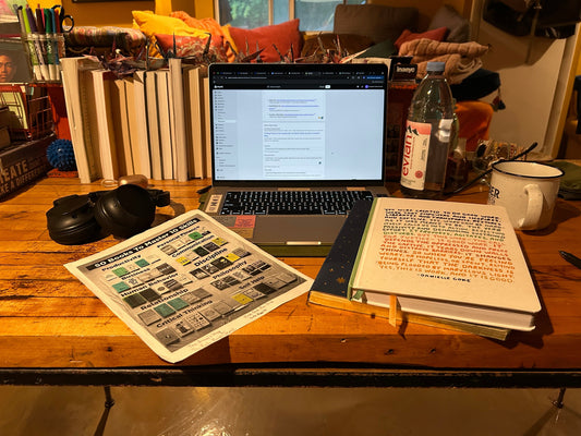Woman journaling in home office — story about resilience, rebuilding, and finding peace after financial loss